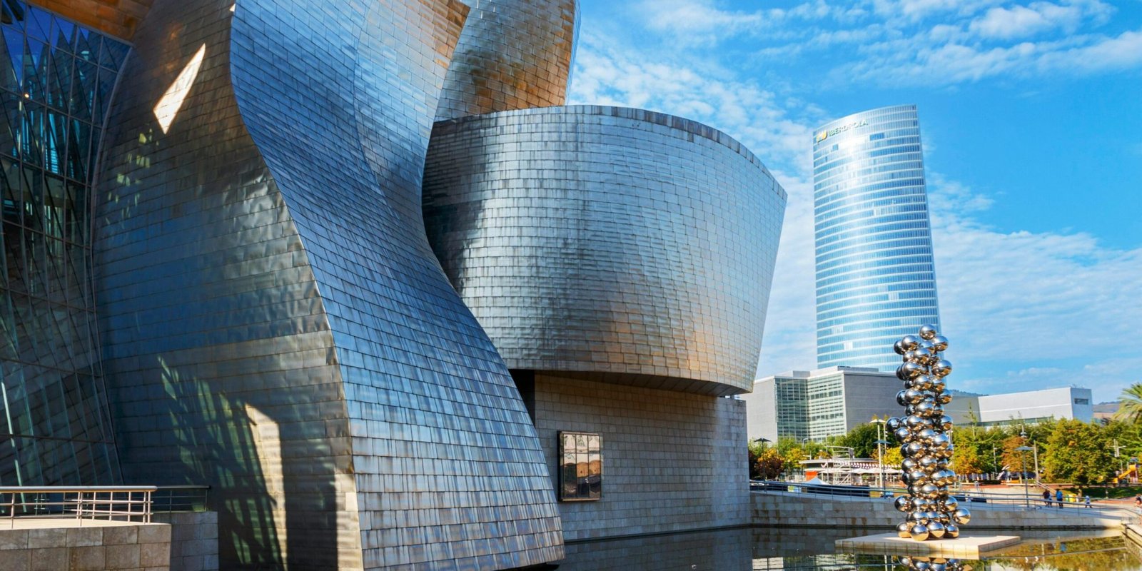 Stunning view of Guggenheim Museum in Bilbao under a clear blue sky.